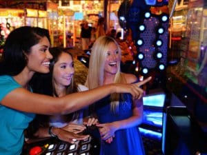 A Group Of Girls Enjoying The Arcade At iPlay America