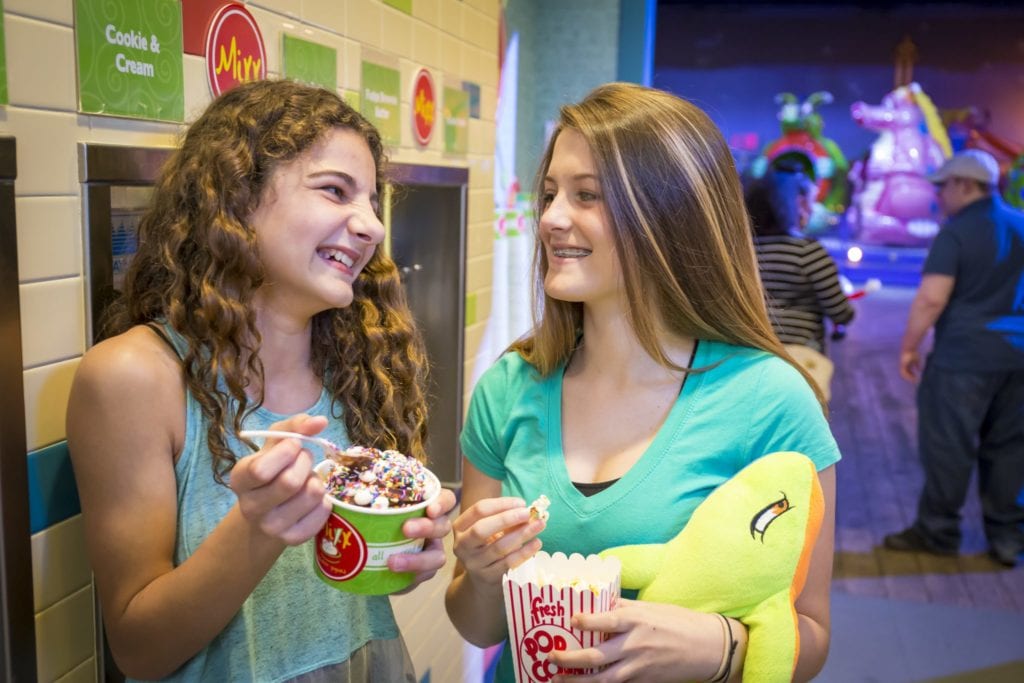 Two girls enjoying soft yogurt