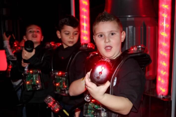 Children playing laser tag at iPlay America